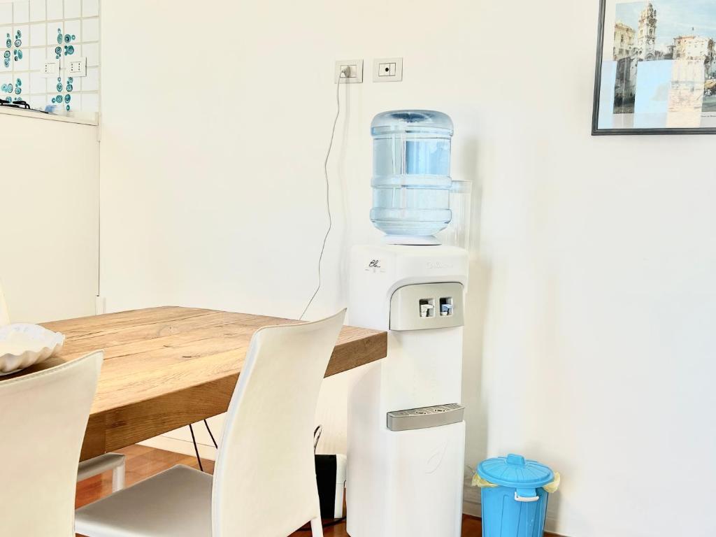 a food processor sitting next to a table with white chairs at La Gaetana in Gaeta