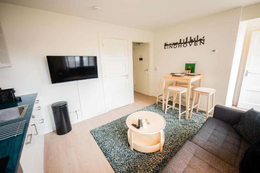 a living room with a couch and a table at Amazing 50m2 Two-Bedroom Apartment - TS307A in Eindhoven