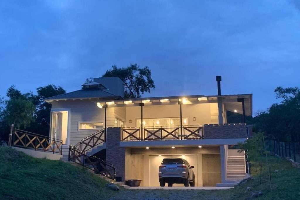 a truck parked in front of a house at CASA VIVE, EL MEJOR PAISAJE De SALTA in Salta
