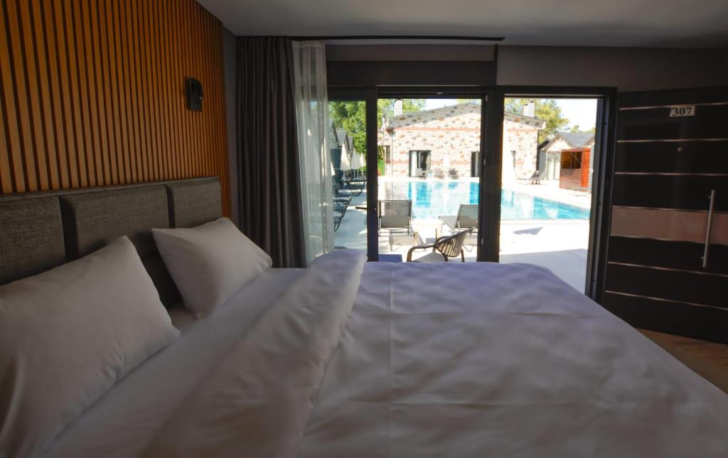 Postel nebo postele na pokoji v ubytování Ağva Casa Rosa Bungalov Otel