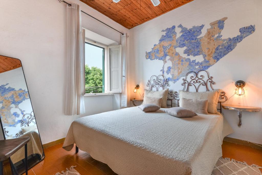 En eller flere senge i et værelse på Casina vintage - Rio Marina