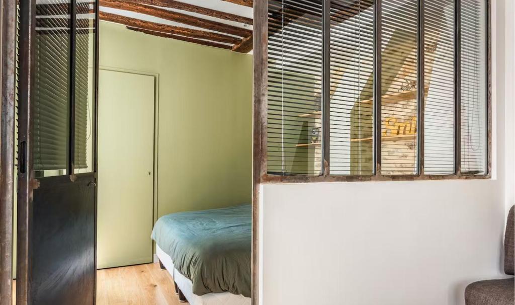 Posteľ alebo postele v izbe v ubytovaní The 199 - Charming apartment in the heart of Paris