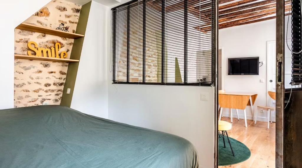 Posteľ alebo postele v izbe v ubytovaní The 199 - Charming apartment in the heart of Paris