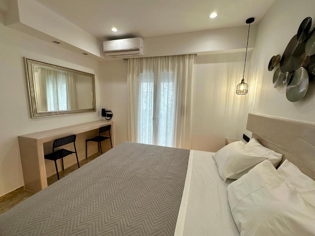 Łóżko lub łóżka w pokoju w obiekcie Aphrodite Hotel & Apartments