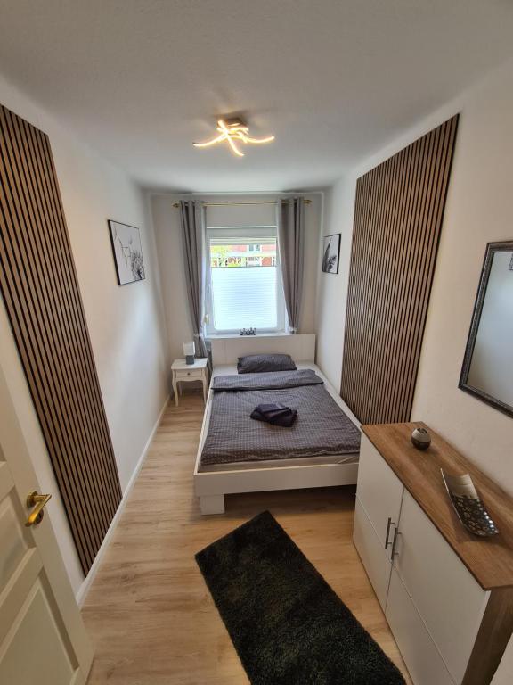 Postel nebo postele na pokoji v ubytování Stadtoase am Rathaus Emden