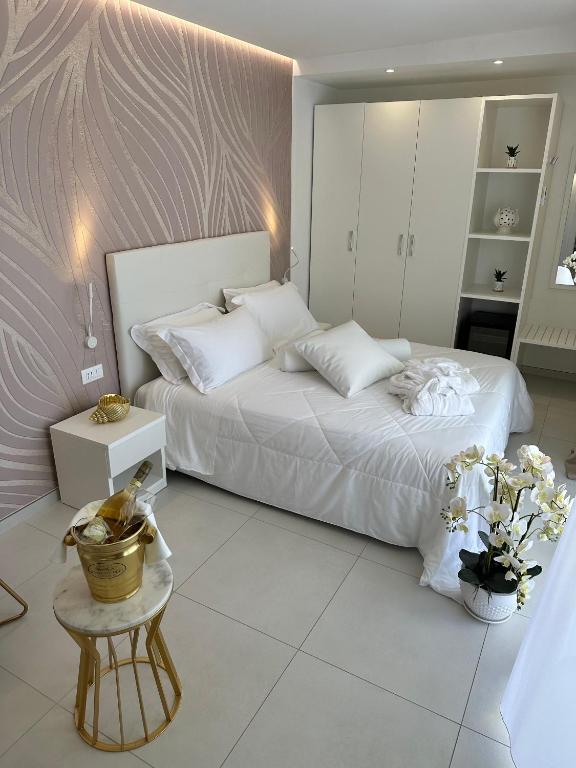 Letto o letti in una camera di Sirena Suite Deluxe