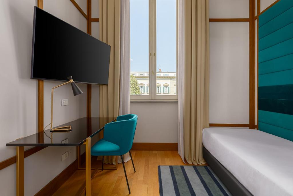 TV a/nebo společenská místnost v ubytování Room Mate Luca, Florence