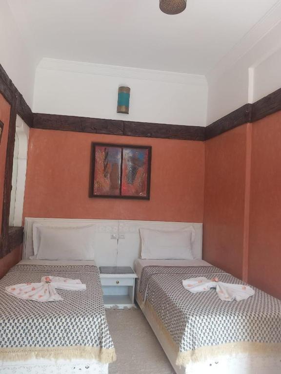Postel nebo postele na pokoji v ubytování Auberge kasbah tifirte
