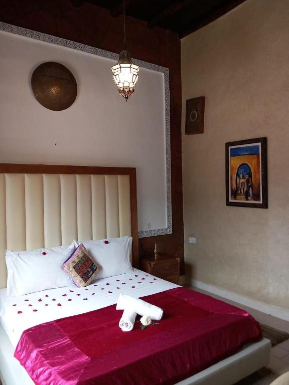 Postel nebo postele na pokoji v ubytování Auberge kasbah tifirte