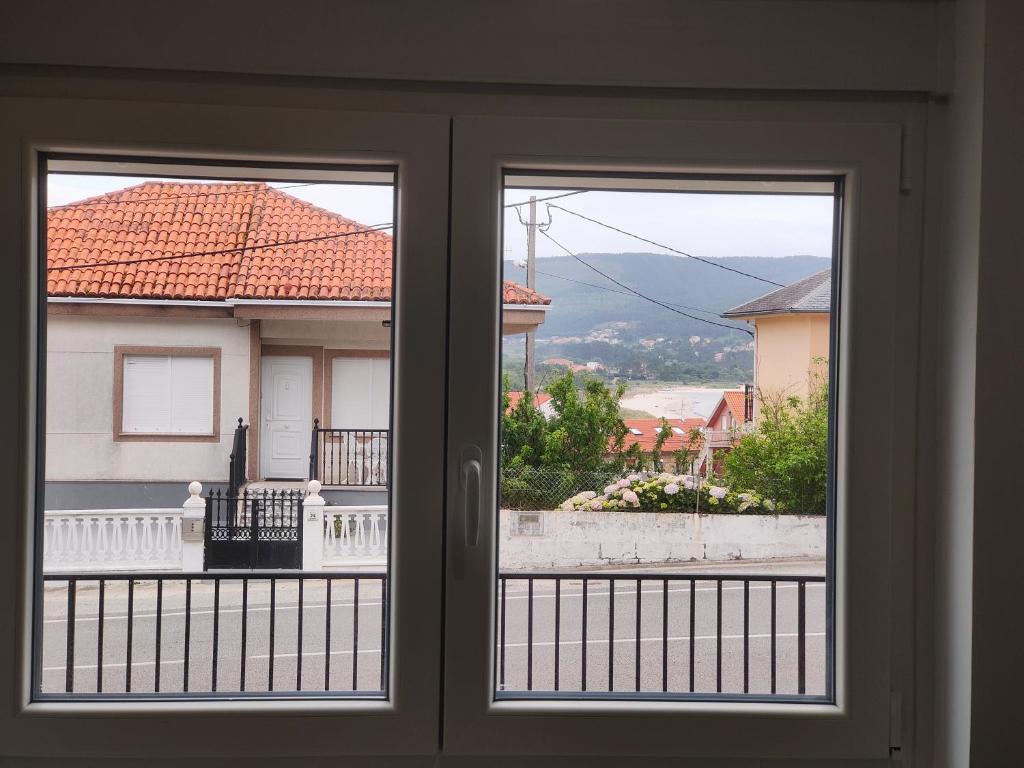 a view from a window of a house at Pension Casa Pedro in Fisterra