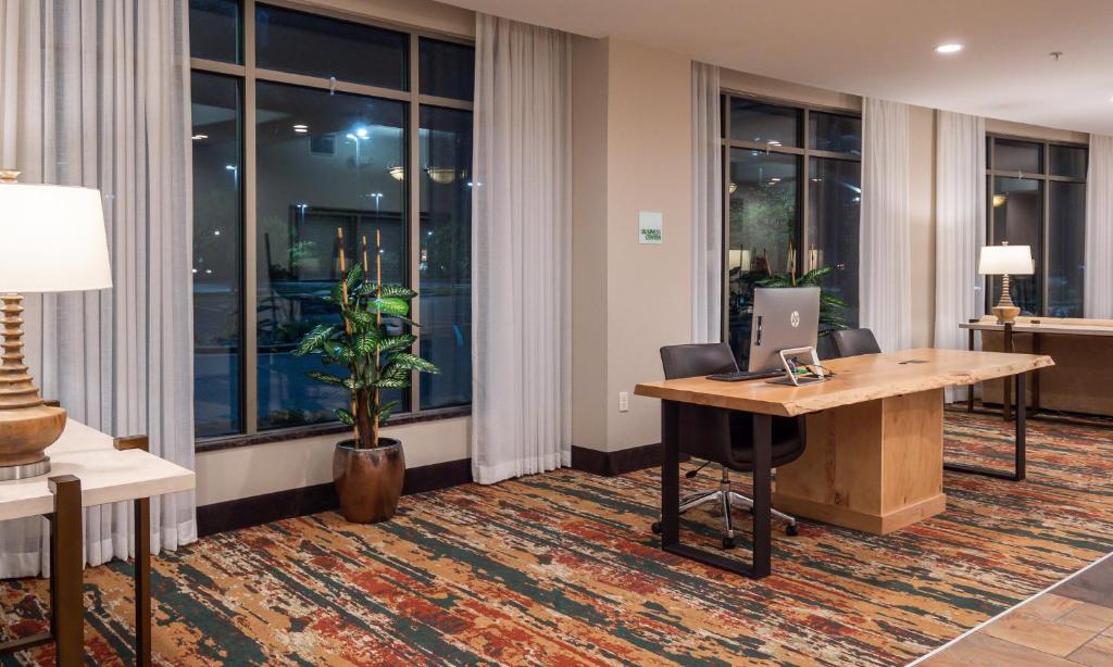 an office with a desk with a laptop on it at Holiday Inn Stevens Point - Convention Center by IHG in Stevens Point