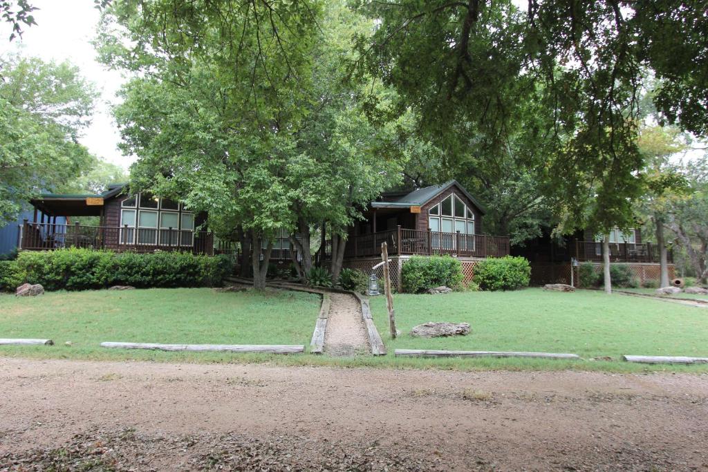 a house with a large yard in front of it at Fig Cabin in Fredericksburg