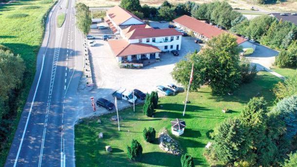 an aerial view of a house with a parking lot at Hotel Medio Fredericia in Fredericia