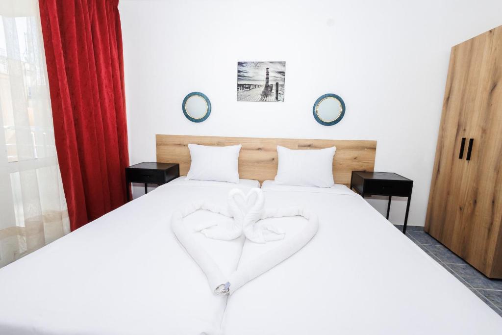 Postel nebo postele na pokoji v ubytování Hotel Arsenal