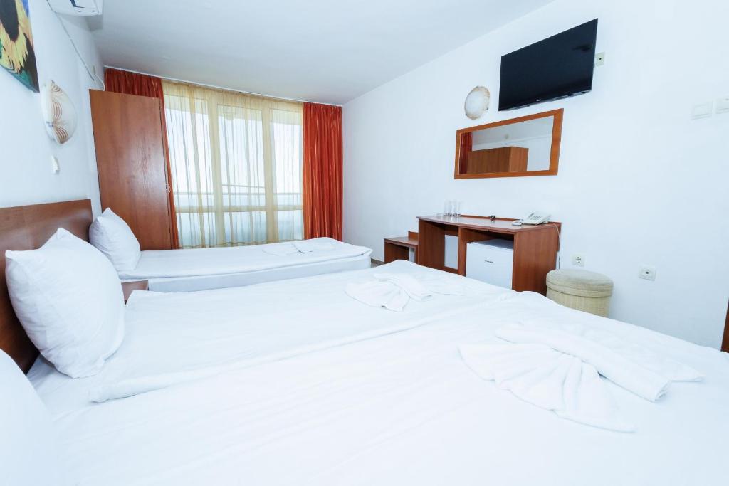 Postel nebo postele na pokoji v ubytování Hotel Arsenal
