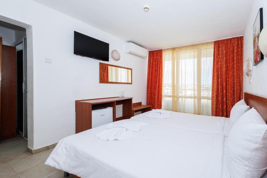 Postel nebo postele na pokoji v ubytování Hotel Arsenal