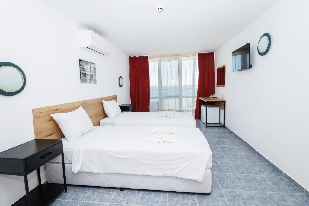 Postel nebo postele na pokoji v ubytování Hotel Arsenal
