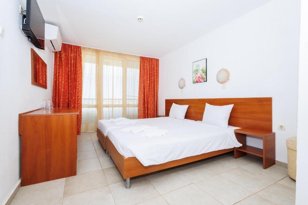 Postel nebo postele na pokoji v ubytování Hotel Arsenal