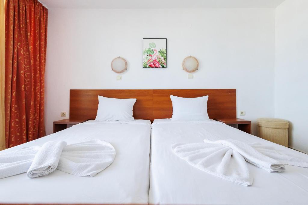 Postel nebo postele na pokoji v ubytování Hotel Arsenal