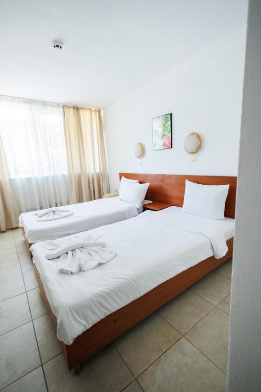 Postel nebo postele na pokoji v ubytování Hotel Arsenal