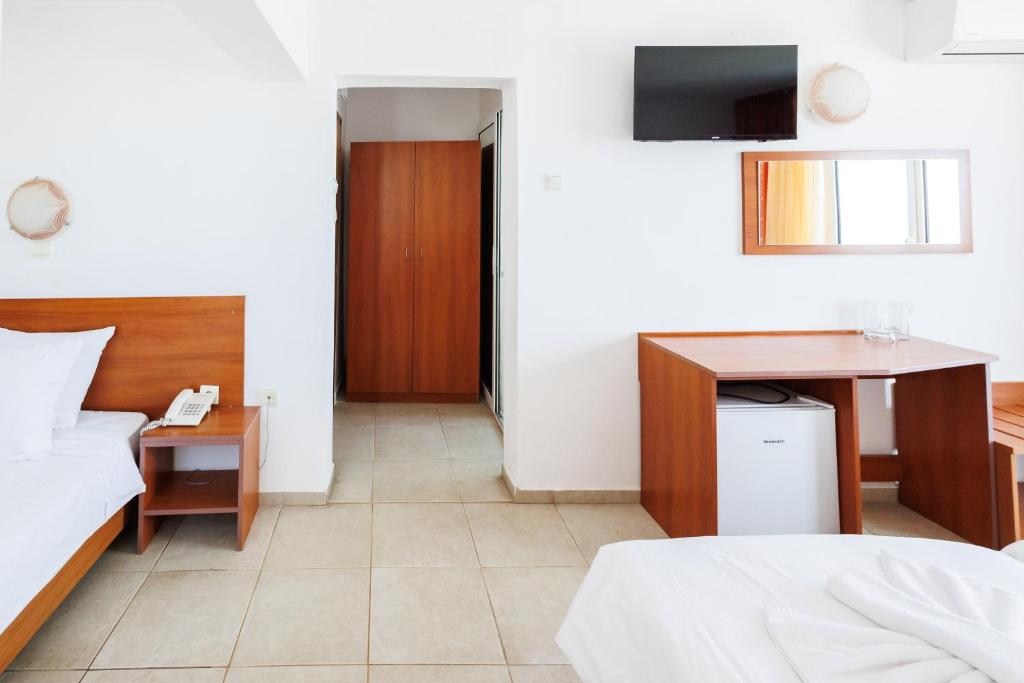 Postel nebo postele na pokoji v ubytování Hotel Arsenal