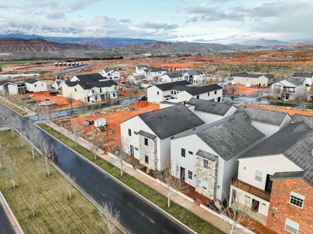 an aerial view of a town with white houses at The Millie at Sand Hollow in Hurricane