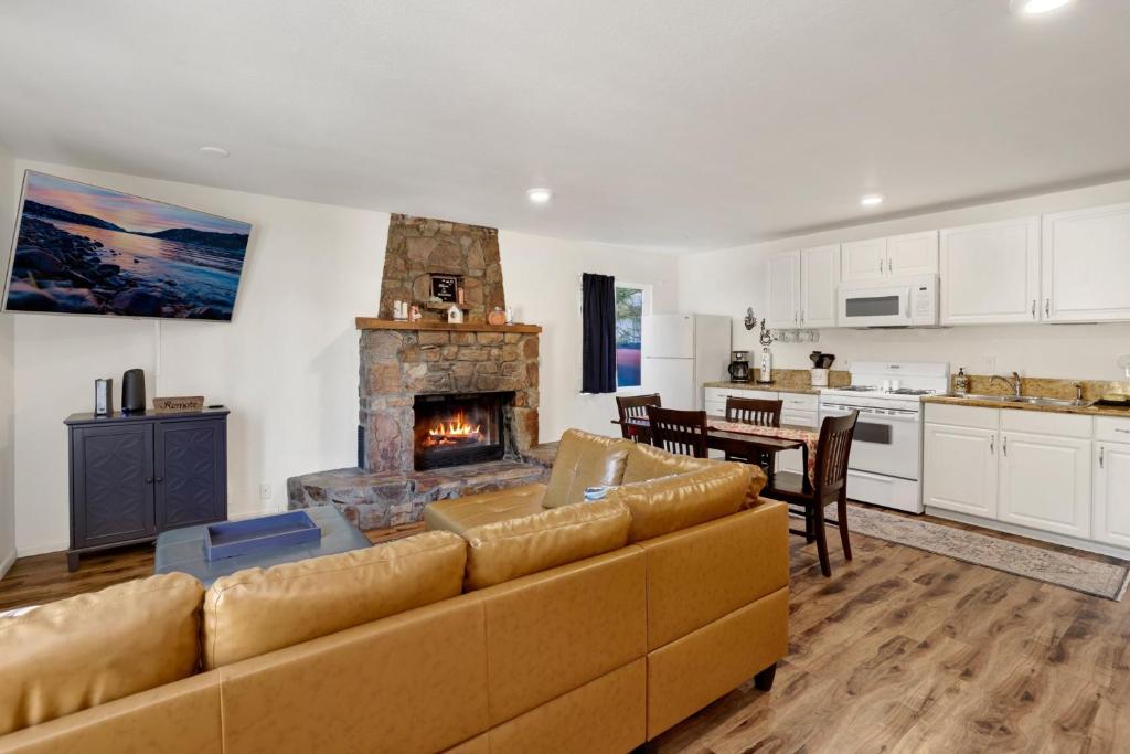 a living room with a couch and a fireplace at The weekender #2342 in Big Bear City