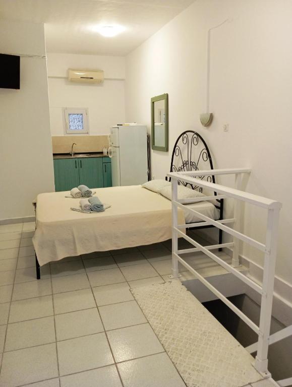 Postel nebo postele na pokoji v ubytování Sirocco Seaside