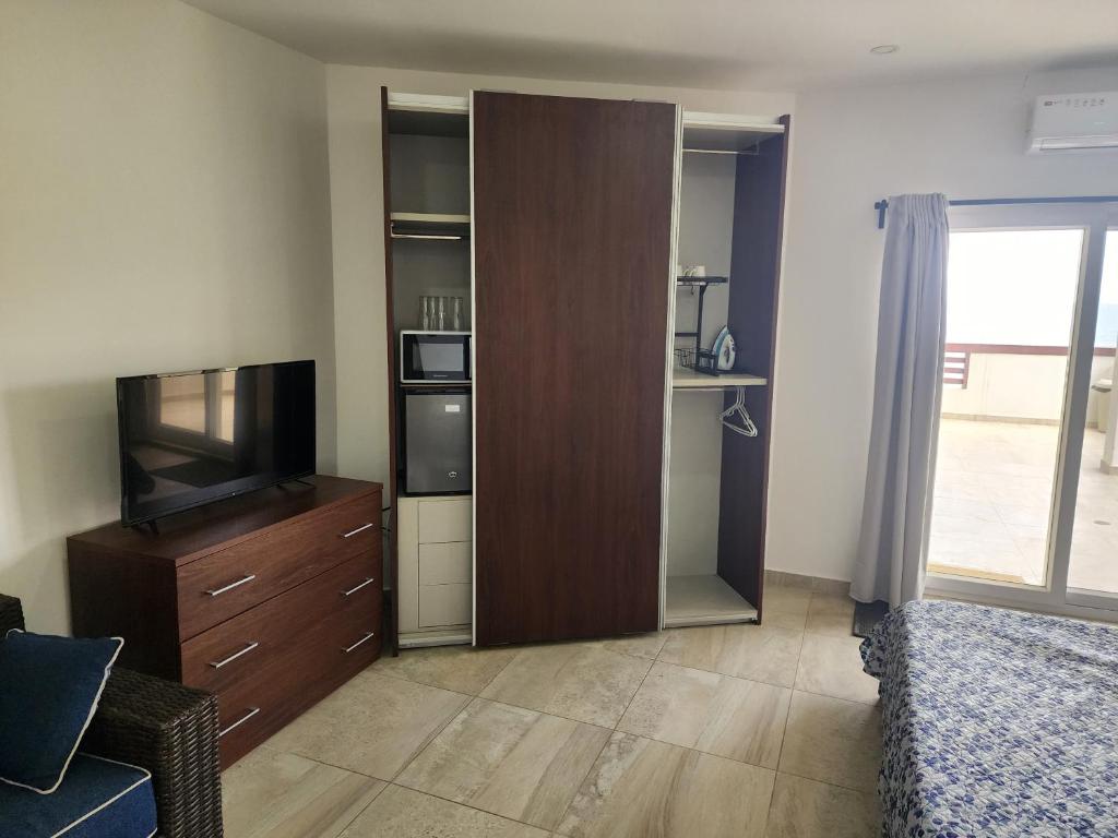 TV a/nebo společenská místnost v ubytování OCEAN FRONT, Las Palmas, Villa 1320