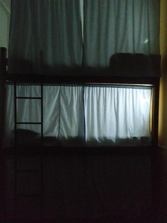 Postel nebo postele na pokoji v ubytování É Hostel