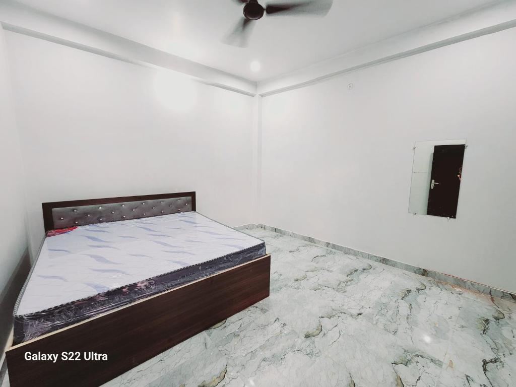 Postel nebo postele na pokoji v ubytování Raghubir Nikunj Homestay