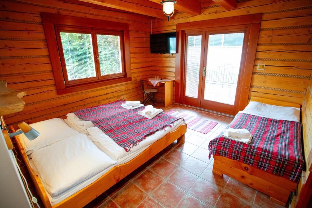 Letto o letti in una camera di Penzion Oravsky Zrub
