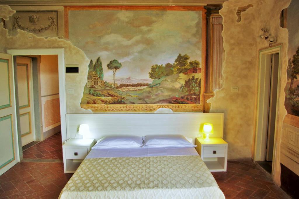 Postel nebo postele na pokoji v ubytování hu Norcenni Girasole village