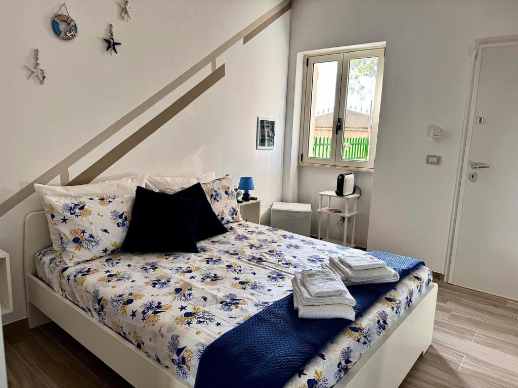 Postel nebo postele na pokoji v ubytování Elegant Dei Rooms