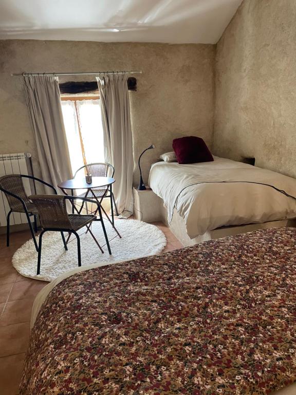 Postel nebo postele na pokoji v ubytování Moulin de l’Arcas