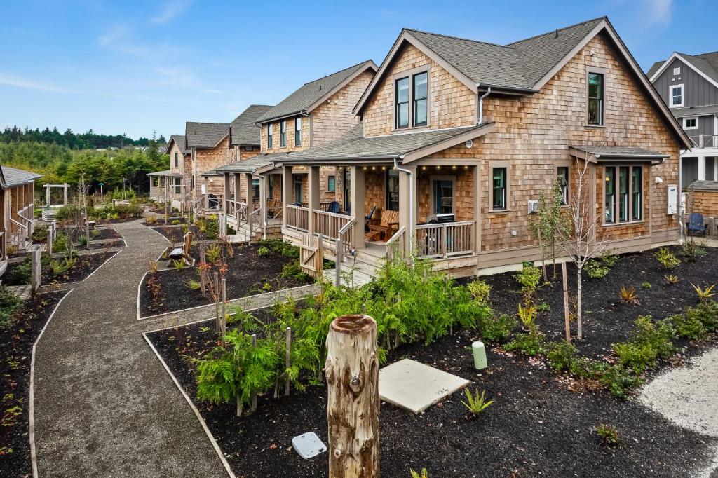 a home with a garden in the front yard at Beach Hair Don't Care by Seabrook Hospitality in Pacific Beach