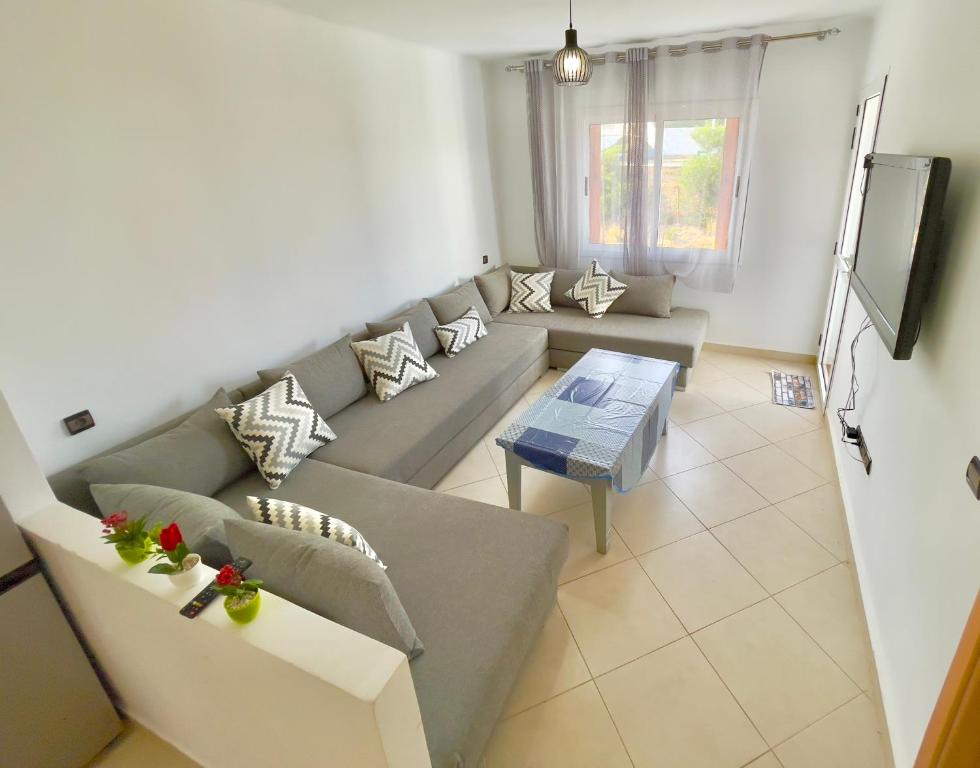 TV a/nebo společenská místnost v ubytování CaboNegro Beach Residence