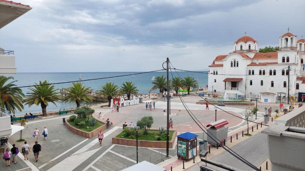 a view of a city with people walking on a street at Catherine's Beachfront Apartment by Optimum Link in Paralia Katerinis