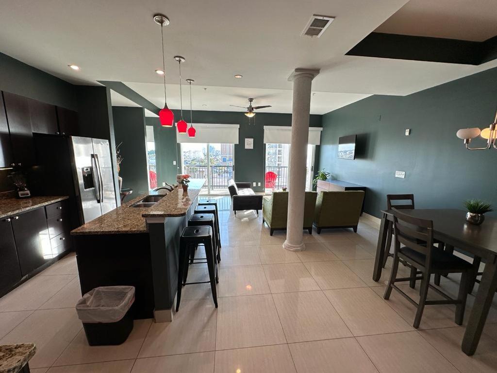 a kitchen and living room with tables and chairs at Bali Bay Resort in Myrtle Beach