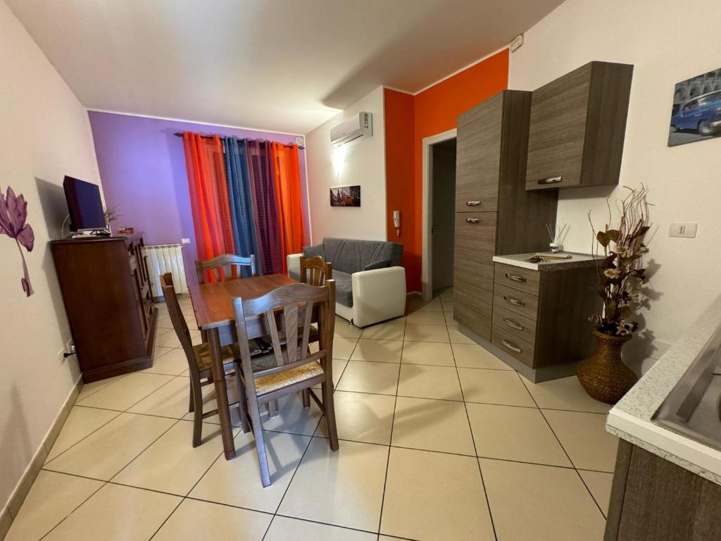 a kitchen with a table and a dining room at La casa di Glenda bis in Terni