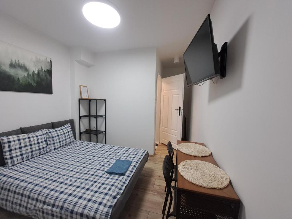 Postel nebo postele na pokoji v ubytování Domek w Parku Hel