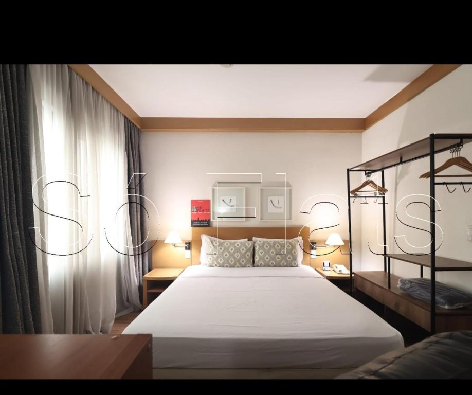 Un pat sau paturi într-o cameră la Tatuapé flat services, ótima localização