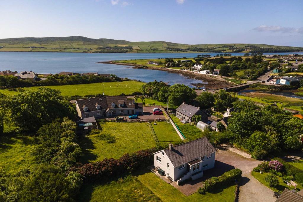 an aerial view of a house and a lake at Beautiful Modern Home In Dingle 5 min walk to town in Dingle