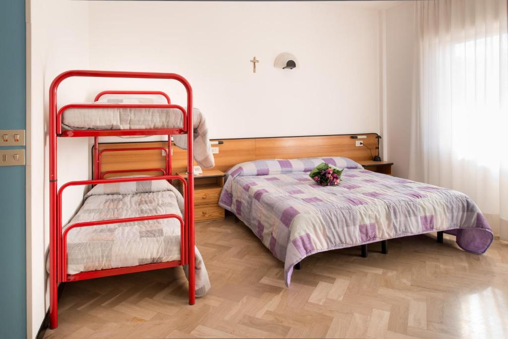 Postel nebo postele na pokoji v ubytování Hotel Crocenzi