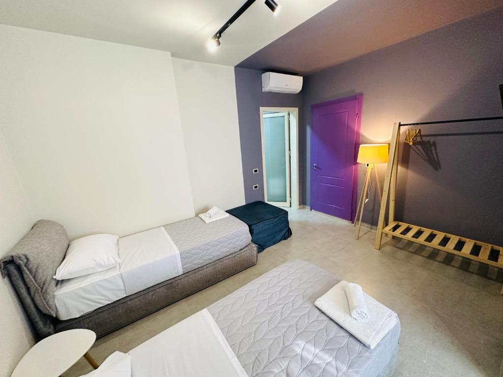Postel nebo postele na pokoji v ubytování STAY-FIVE rooms & apartments