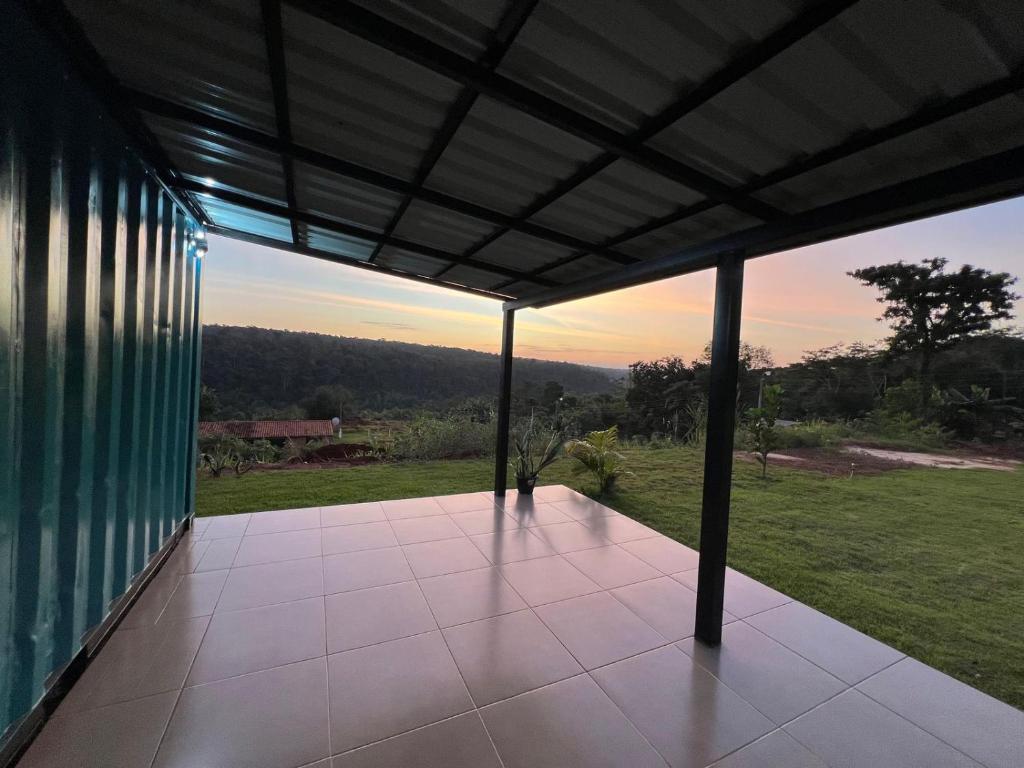 a screened in porch of a house with a view at Container Home Py in Puerto Presidente Franco