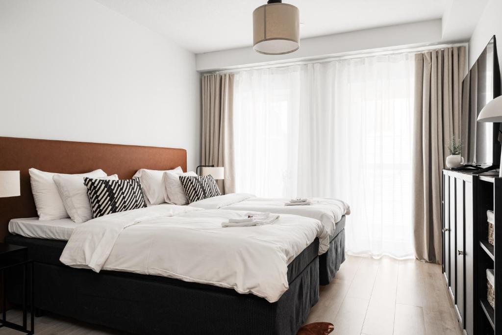 En eller flere senge i et værelse på Borg Loft City Central