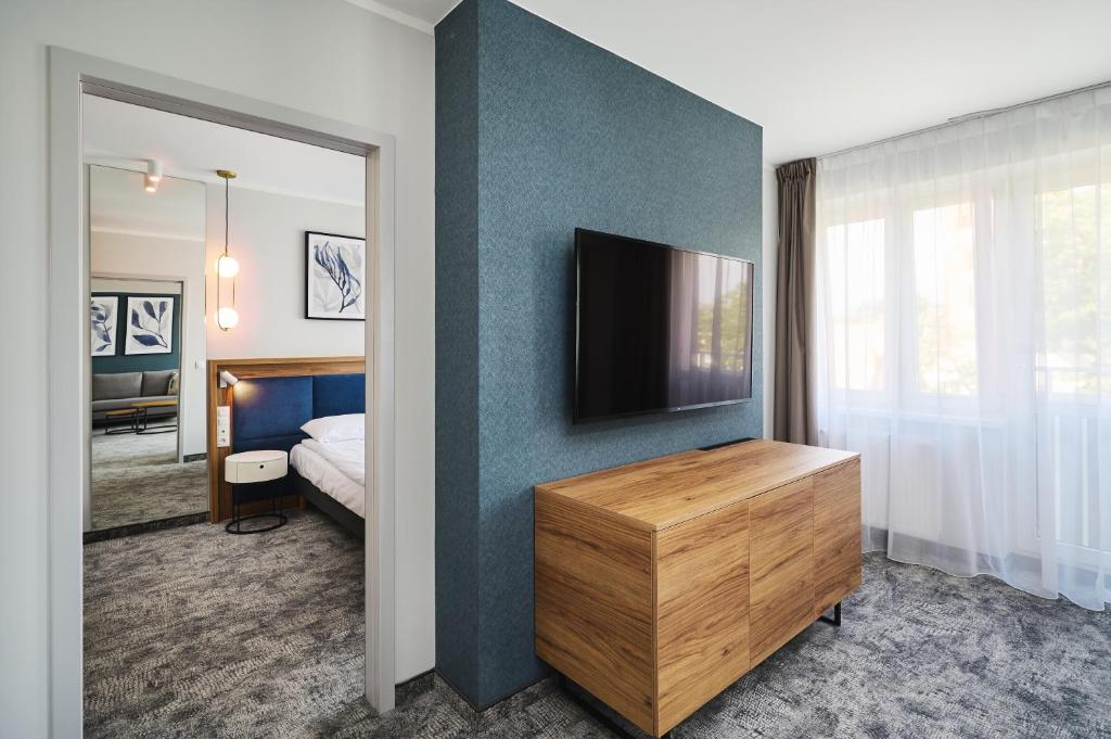 TV a/nebo společenská místnost v ubytování Hotel Halo Toruń