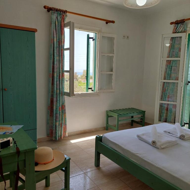 Postel nebo postele na pokoji v ubytování HOTEL KAPARI