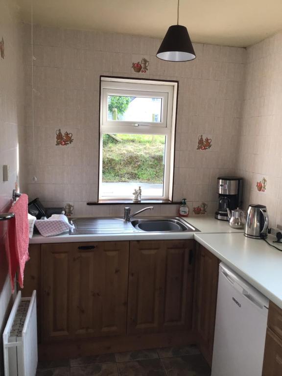 Kuchyň nebo kuchyňský kout v ubytování Swilly View House